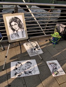 The work of a portrait sketch artist on Hungerford Bridge...